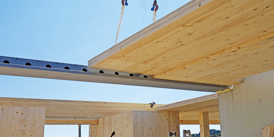 Geïntegreerde staal-betonligger  perfect toepasbaar in houtconstructie